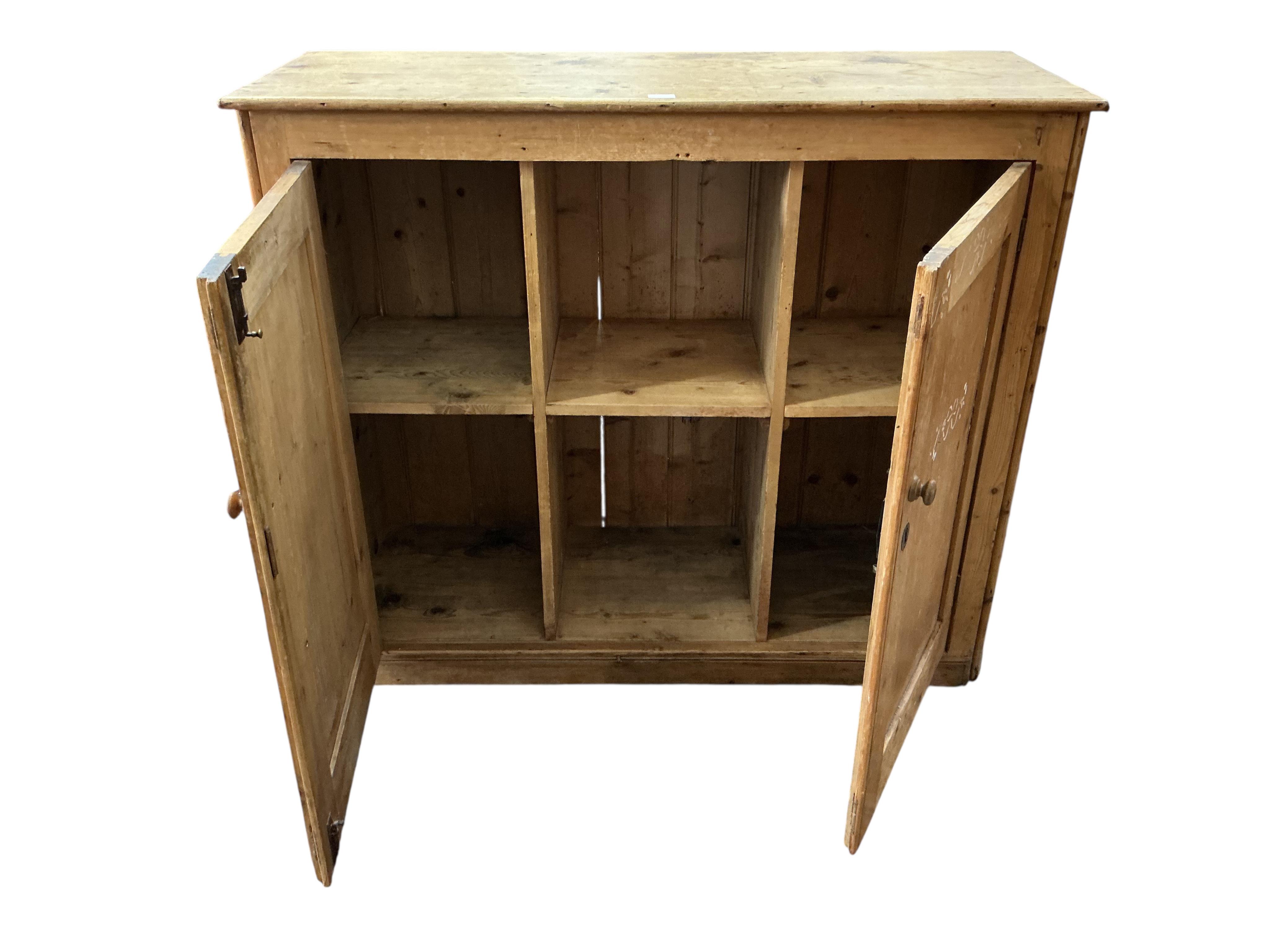A Victorian pine side cabinet, width 131cm, depth 49cm, height 111cm